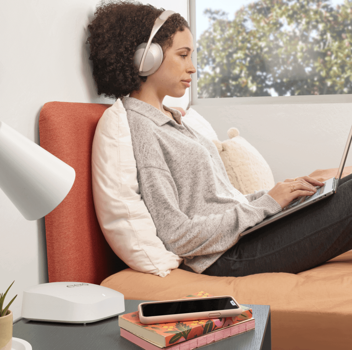 Woman with headphones browsing ad-free internet